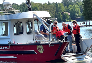 volunteers loading onto fireboat